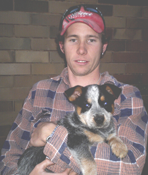 Pup #7 - Zorrette @ 8 Weeks with her new person Josh. Don't forget to VOTE for ME!