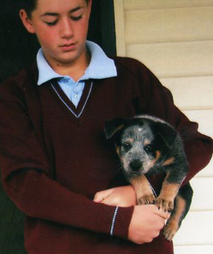 Pup #3 - Zoe (formerly Odd Ball) @ 8.5 Weeks - with her new person - Tyson. Don't forget to VOTE fro ME!